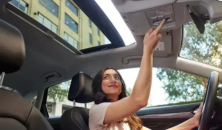 woman driving used volkswagen car